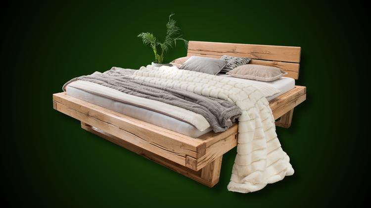 ERM Kensington wood bed featuring a solid oak frame, natural oiled surface, and cozy bedding accents.