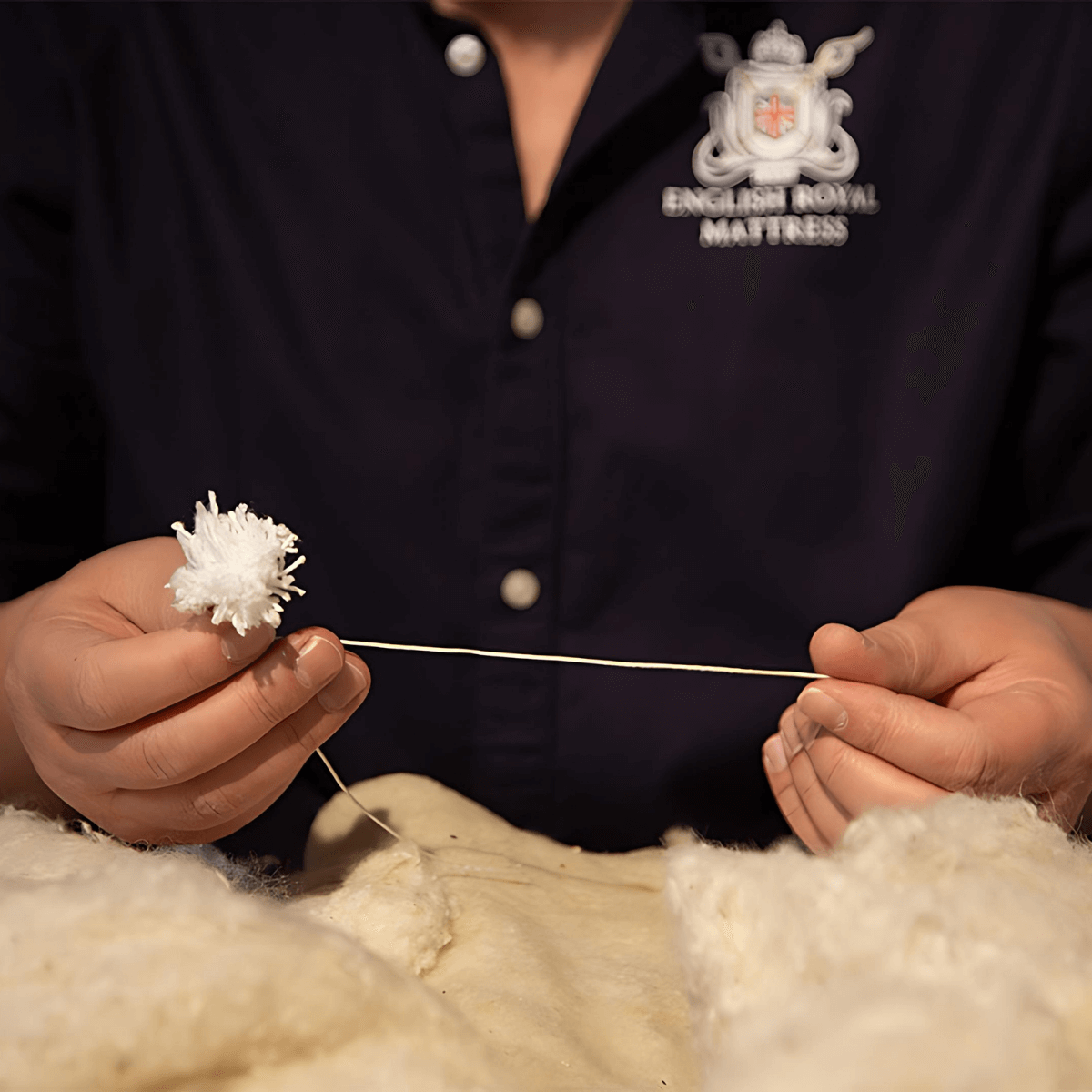 Crafting an English Royal Mattress using natural fillers for traditional, organic quality.